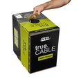 A hand lifting the "trueCABLE" box using its carrying handle, showing portability.