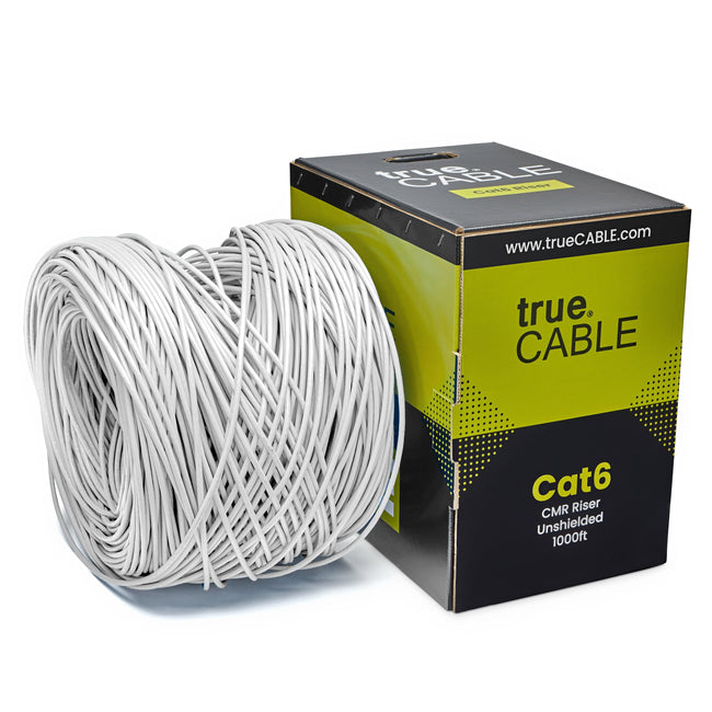 A spool of White Cat6 cable on a white background. The spool is labeled "TrueCABLE Cat6 CMR Riser Unshielded 1000ft white Ethernet Cable"