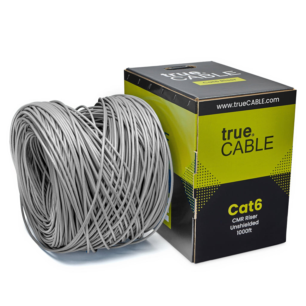 A spool of Gray Cat6 cable on a white background. The spool is labeled "TrueCABLE Cat6 CMR Riser Unshielded 1000ft Gray Ethernet Cable