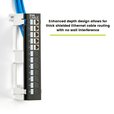trueCABLE 12-port wall mount patch panel installed with enhanced depth design for thick shielded Ethernet cables, ensuring no wall interference.